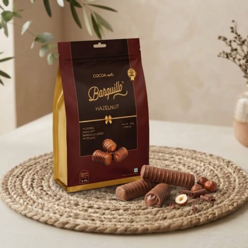 Cocoa Melts Hazelnut 100g pouch with milk chocolate wafer rolls and hazelnuts